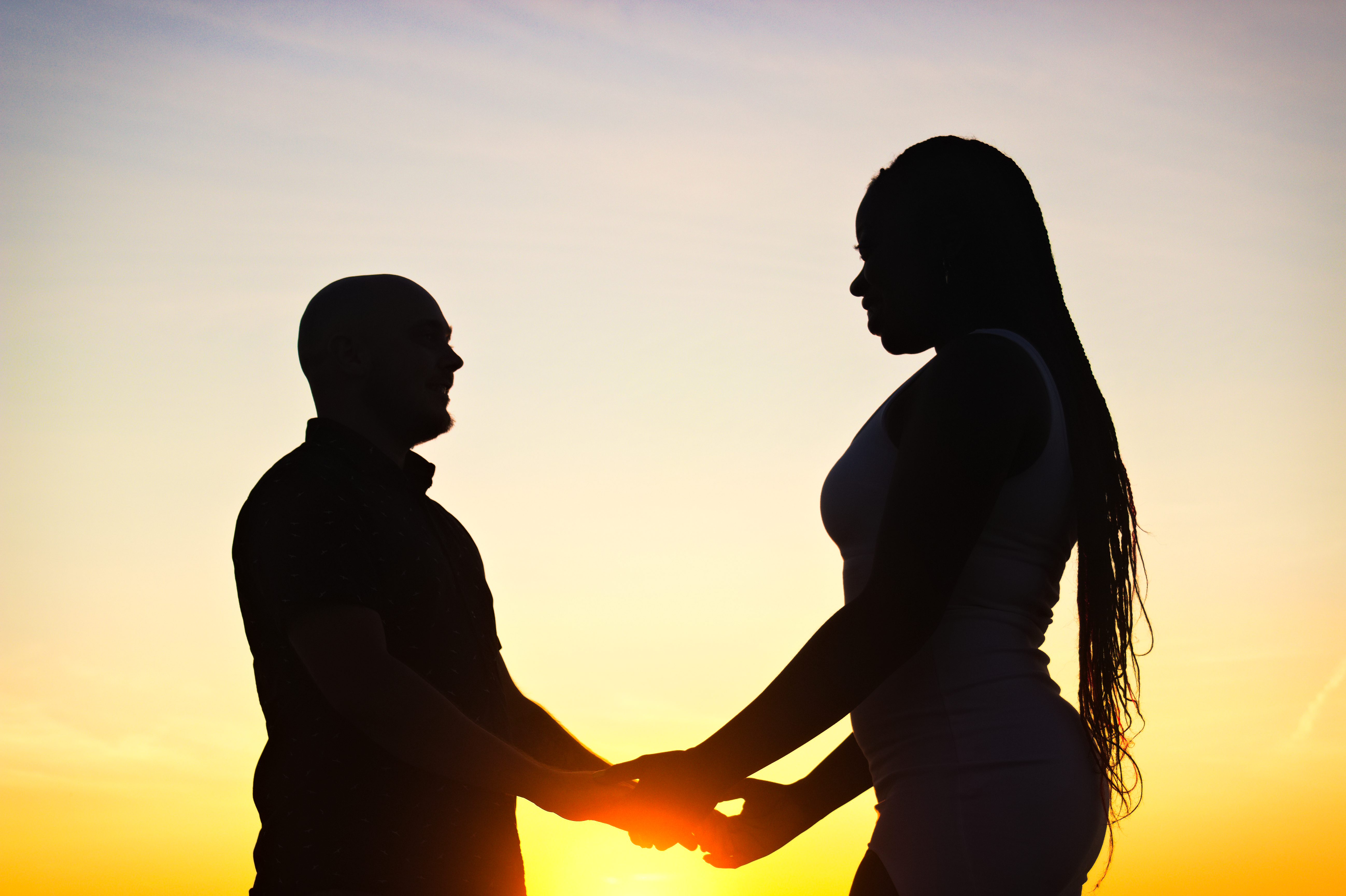 Couple holding hands silhouette